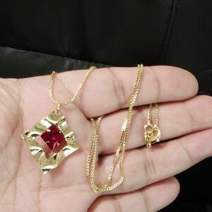 Radiant Gold Necklace with Ruby Accent